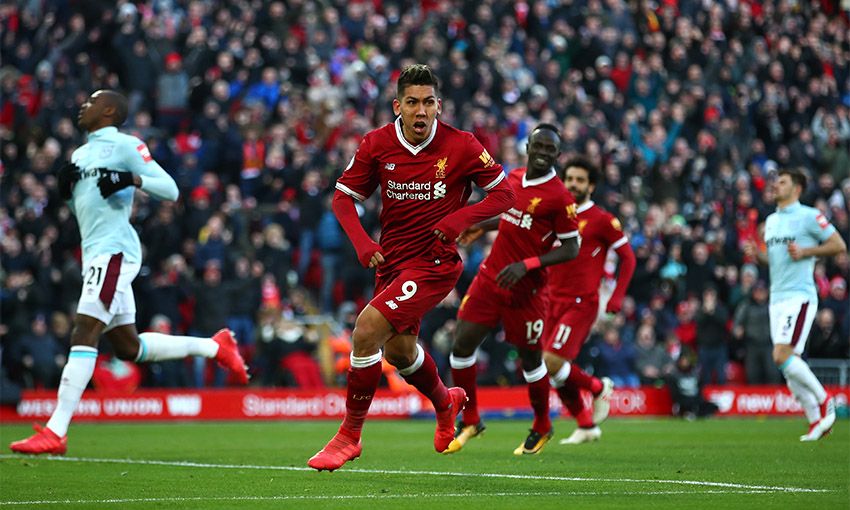 Roberto Firmino celebrates scoring Liverpool's third goal against West Ham United at Anfield.
