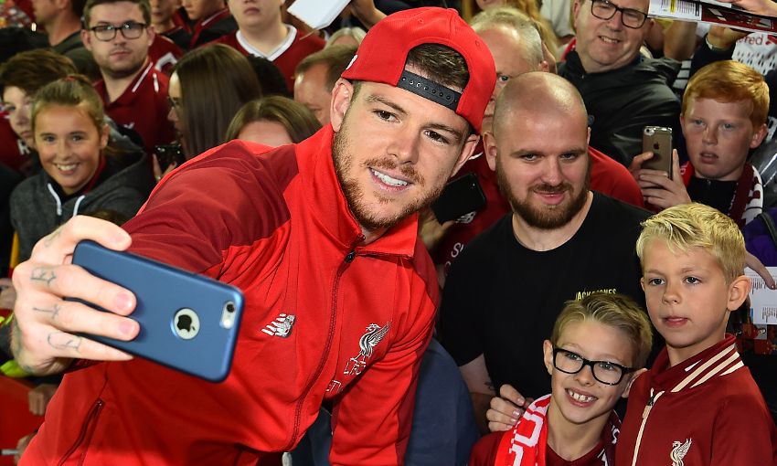 Alberto Moreno poses with Liverpool fans at Anfield after the win over Torino.