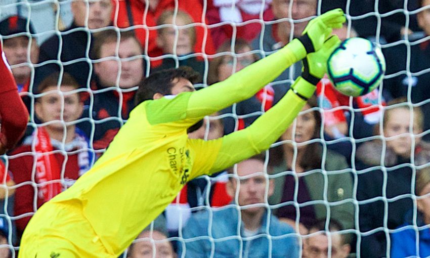 Liverpool's Alisson makes a save against Brighton