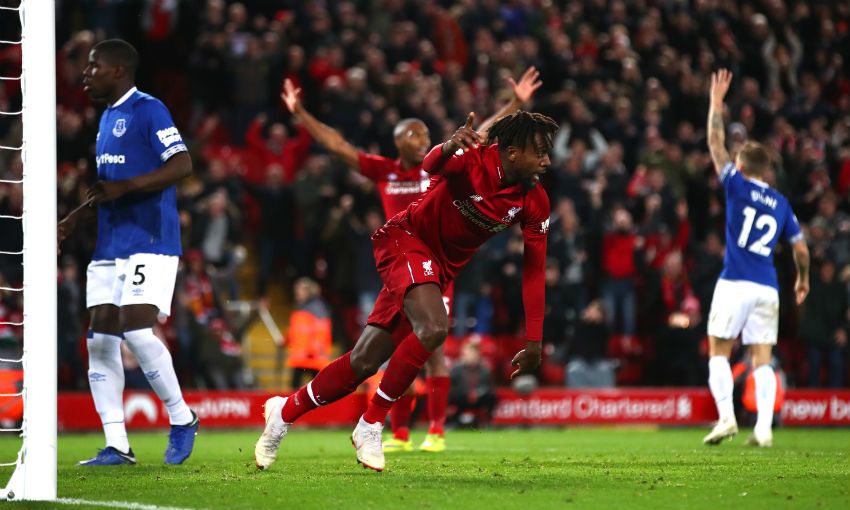 Divock Origi of Liverpool FC celebrates scoring the winning goal v Everton