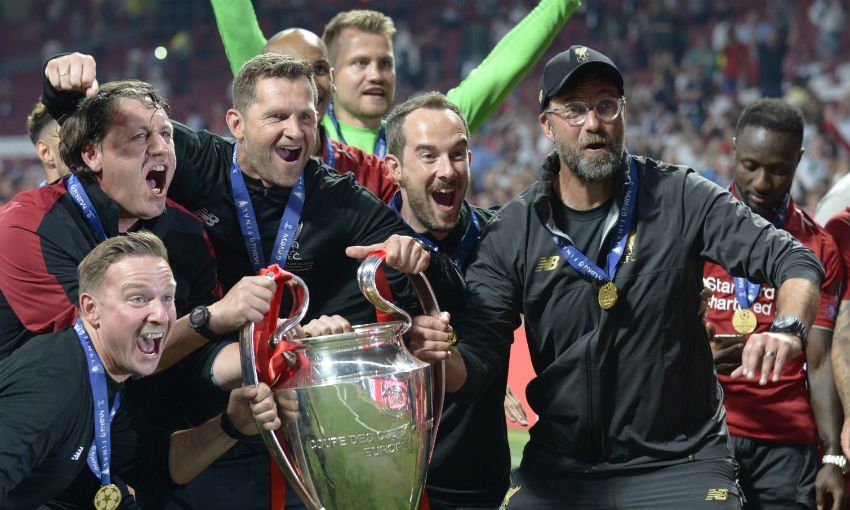 Liverpool coaching staff with Champions League trophy