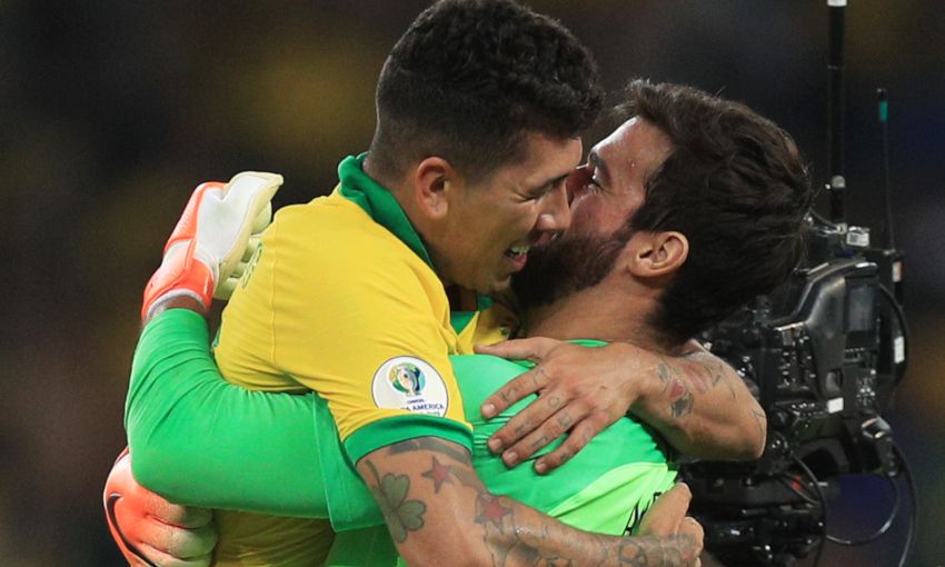 Roberto Firmino and Alisson Becker celebrate victory with Brazil
