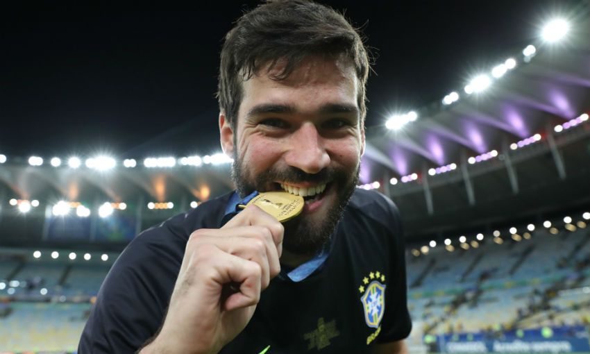 Alisson Becker of Brazil with Copa America medal