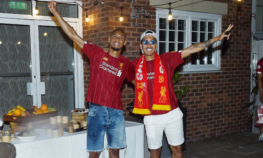 Fabinho and Roberto Firmino of Liverpool celebrating winning the Premier League on June 25, 2020 in Liverpool, England.
