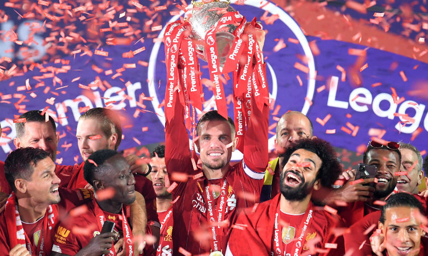 Jordan Henderson of Liverpool FC lifts Premier League trophy