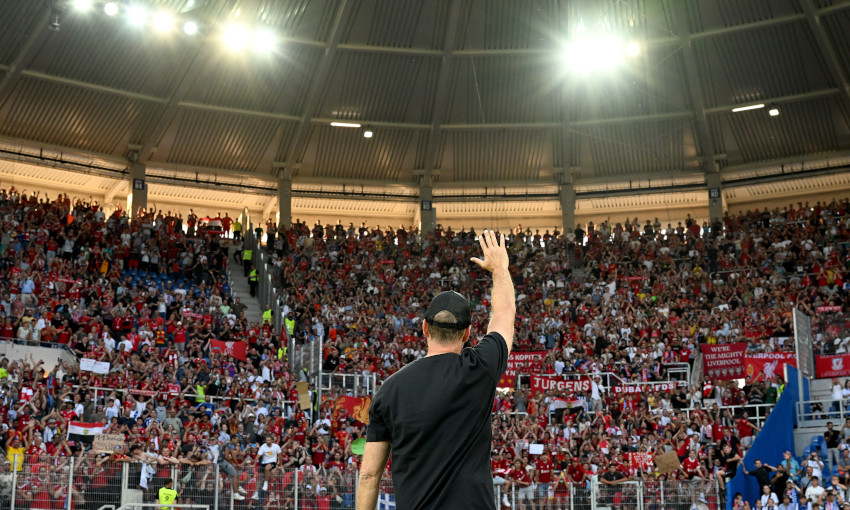 Jürgen Klopp acknowledges the travelling fans after Liverpool's pre-season friendly at Karlsruher SC