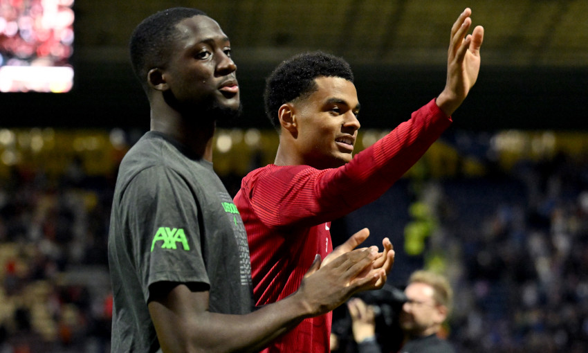Ibrahima Konate and Cody Gakpo wave to Liverpool fans at Deepdale