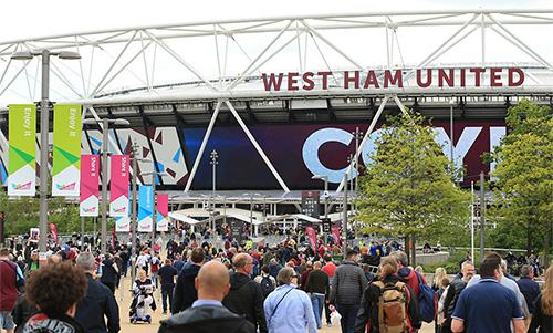 West Ham fans make their way to the London Stadium