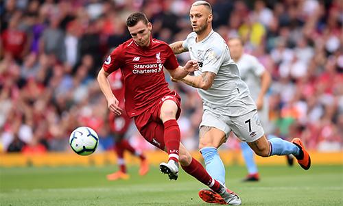 Liverpool's Andy Roberston battles with West Ham United's Marko Arnautovic.